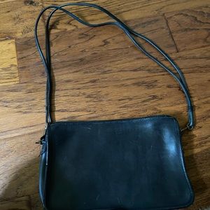 Black vintage crossbody Coach purse.
